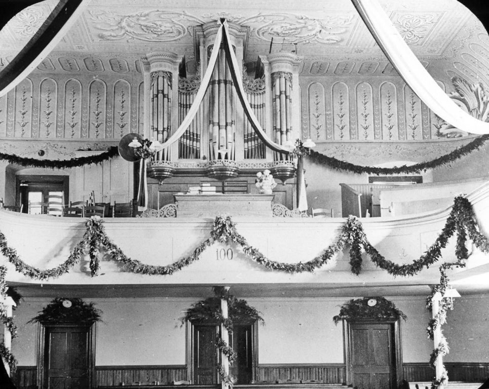 The church and organ decorated for the 100th anniversary of the building and organ, c. 1900. Photo courtesy of Old Salem, Inc. 